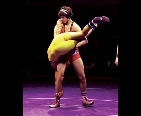 Chief Cole Snyder uses muscle power to throw his opponent to the mat at the Pirate-hosted duals.