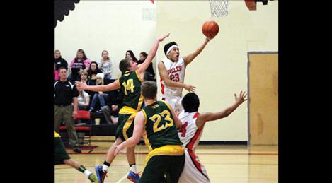 unior Chino Lira goes in for a layup. Lira has been a great help, adding support for the Eagles in the point department.