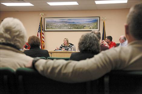 Nicole Tavenner/Valley Journal Polson Mayor Heather Knutson listens intently as Melissa Hornbein, staff attorney for the Reserved Water Rights Compact Commission presents information on how the water comact affects municipalities.