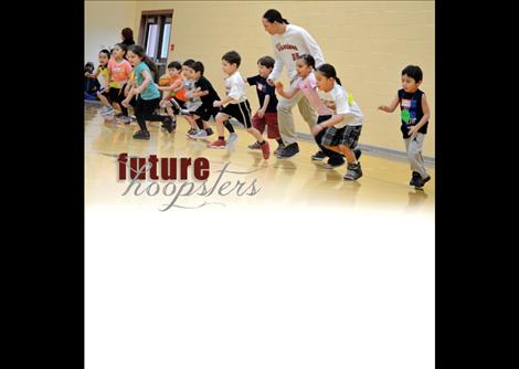 Isaac Desjarlais, 17, works on drills with the children.
