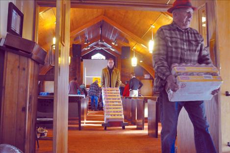 Volunteers wheel a mountain of soup from the Ronan Seventh Day Adventist Church. 