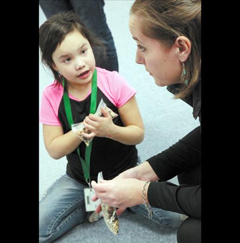 Kids are given trail mix for snack time.