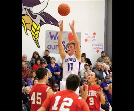 Viking Kobe Cox fights off shoots above Warriors’ in Thursday’s valley battle between the valley rivals.
