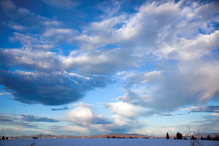 Clouds dot the morning skies over Flathead Lake.