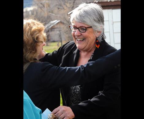 The Nest’s Executive Director Jenifer Blumberg hugs Mary Craigle, board chair of the Montana Community Foundation after she received a $325,000 check to help establish The Nest.