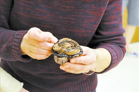 Gluten-free cupcakes are unwrapped by a Chocolate Lover’s Festival volunteer. 