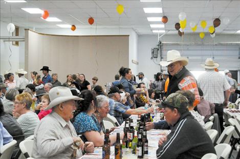 Ranchers enjoy dinner together.