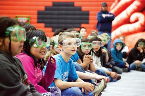 tudents sport eye protection for one of the science demonstrations.