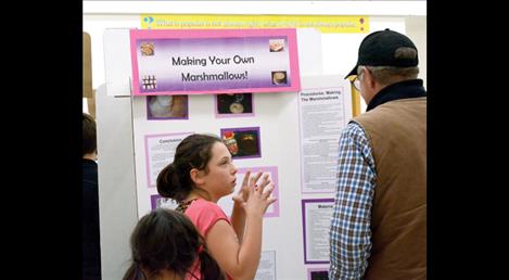 Savanah Nentwig, 12, explains the relation between the ingredients used to make marshmallows and density.