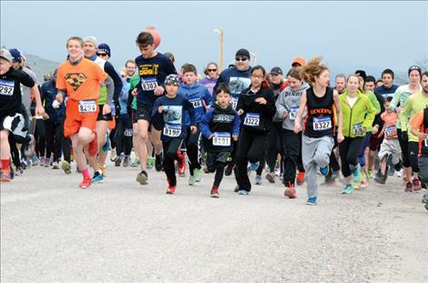  Runners take off Saturday during the Buttercup Run with Dallas Swab, 9, and Aiden Swab, 7, out in front. 
