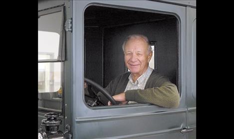 Carl Lindburg smiles from the front seat of a 1926 Model T farm truck that he talked owner Shari Kelley, Palm Springs, California, into donating  to the Garden of the Rockies Museum in 2007.