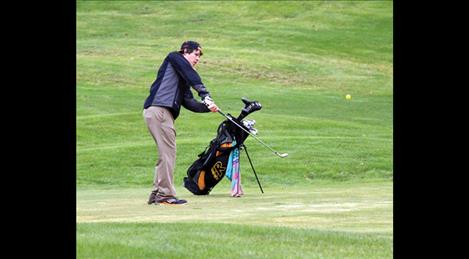 Lane Garcia chips off of the fairway at Tuesday’s  home-hosted tournament.