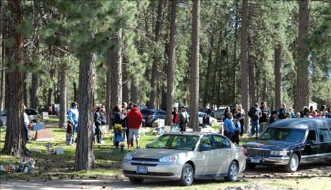 Family and friends honor Alec Quequesah and fill the Ronan cemetery the day of his funeral. 