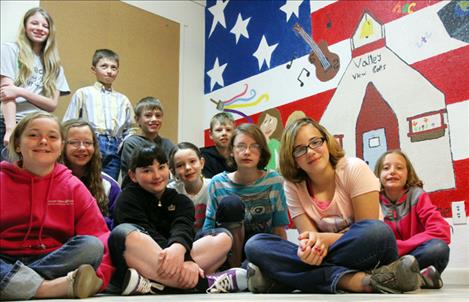 Valley View School’s 3-6 grade students painted a mural on the lunchroom wall that portrays the hobbies, interests and values  of the student body. Artists pictured from back, left are: Kayleigh Burba, Clayton Jensen, TrapperMcAllister, Mason Sloan, (front, left) Shelby Learn, Alexys Orien, Shalom Walker, Ryleigh Bell, Tiana Crist, Emily Gerrity and Claire Crist. Not pictured are Ethan and Esaie Kinsey.