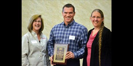 Debbie Vassar, Lake County Job Service Employer Committee chair and Debra Krantz, Lake County Job Services manager in Polson, present “Employers of Choice” awards at their spring workshop. Recipients include fMickRocky Mountain Twist/Jore Corporation, large-scale employer.