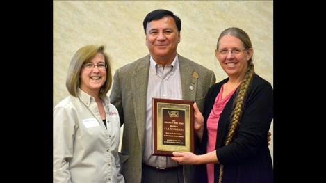 Debbie Vassar, Lake County Job Service Employer Committee chair and Debra Krantz, Lake County Job Services manager in Polson, present “Employers of Choice” awards at their spring workshop to  Thomas Acevedo, midsized company award for S&K Technologies. 