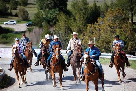 Wranglers head out from Sloan Bridge Saturday morning as the 28-mile drive begins. 