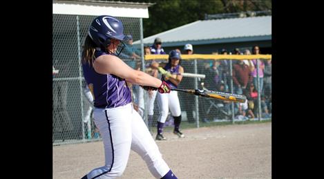 Lady Pirate catcher Sarah Rausch sports a homerun swing while launching the ball over the fence to put the Lady PIrates ahead of number one ranked Columbia Falls in Thursday’s victory.