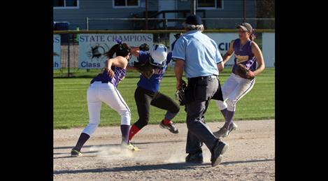 Senior third baseman Taylor Brackey tags out a Wildkat baserunner caught in a pickle gaining an out for the Lady Pirates.