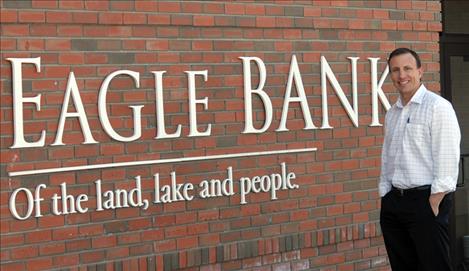 Andrew West stands in front of Eagle Bank where he serves as president and CEO.