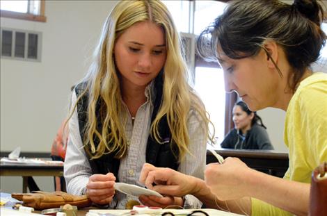 Coquise Frost, 18, learns to bead during a class at Salish Kootenai College with help from her host mom Amy Burland. 