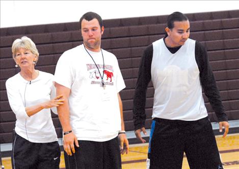 Ceal Barry, University of Colorado senior associate athletic director, positions SKC Bison players as she demonstrates defense techniques. 