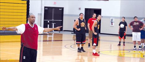 Johnny Dawkins, Stanford’s men’s coach, works with Bison players as he explains his methods for the coaches attending the clinic.