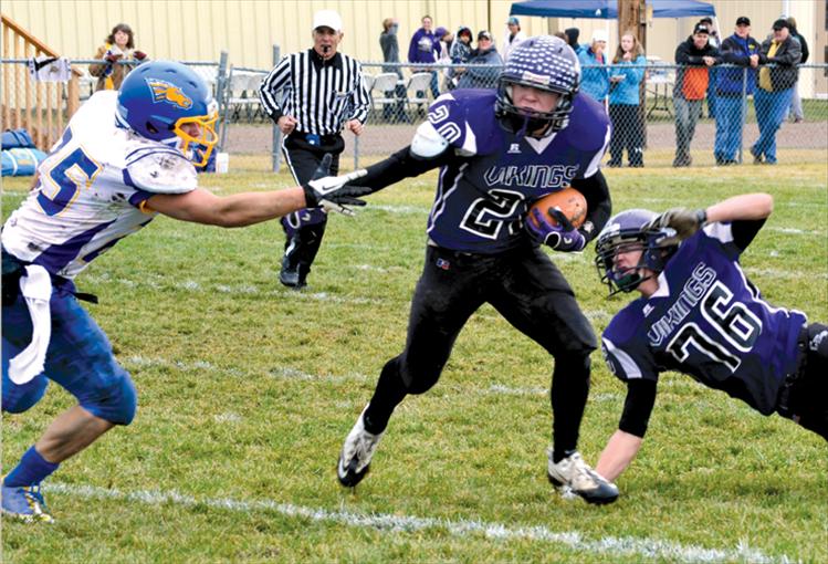 Charlo’s Tyler Delaney avoids a Great Falls defender during a first-round playoff game hosted by Charlo on Saturday. 