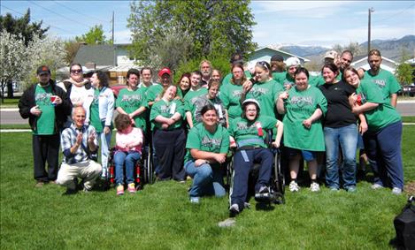 athletes who competed in the regional games in Missoula in April gather for a photograph.