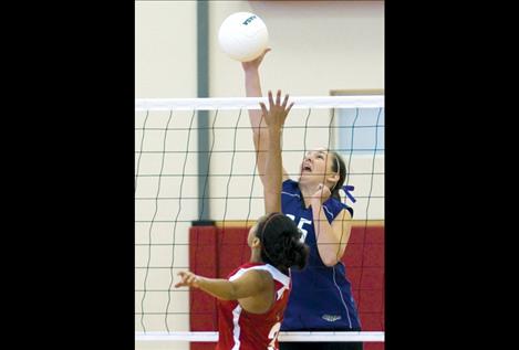 McKalistar Rosenbaum fires the ball over the net during Charlo’s game against Two Eagle in the district tourney.