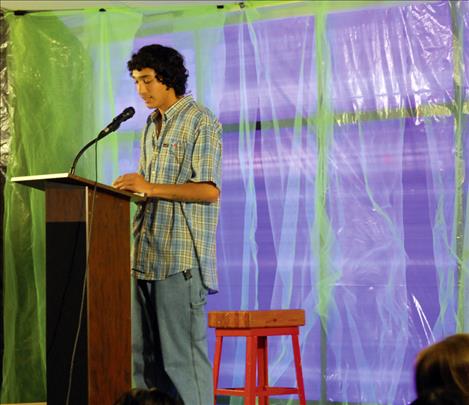 Tyrell Lovegrove, a Two Eagle River student, sings some of his lyrics for the crowd