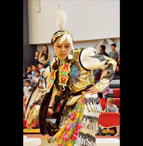 Laurencia Starblanket, 14, dances in the contemporary jingle style.