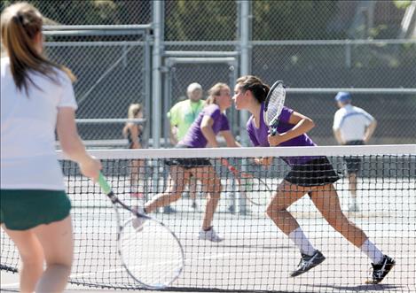 Cassie Carlyle and Olivia Hewston hustle to change places.