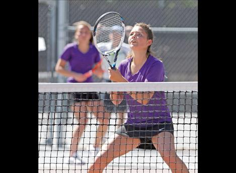 Lady Pirate Cassie Carlyle calls for  doubles partner Olivia Hewston to take a serve  during state tournament play Friday morning in Missoula.
