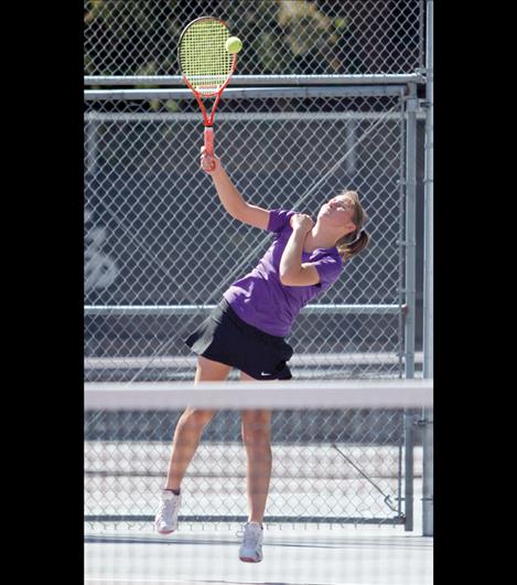 Olivia Hewston serves during her doubles match with partner Cassie Carlyle against Billings Central’s  Meg Fitzgerald and Molly Putnam Friday morning. The Polson duo  eventually lost the match 6-7(4), 6-3, 6-3 to end their tournament run. 