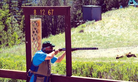 Randy Nelson, a Hayden, Idaho, competitor, calls, “Pull,” for a clay bird. 