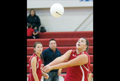 Mahalia Hendren returns a serve against Noxon in the district tournament last week. Hendren is one of two seniors who will be leaving the Scarlets after this season.
