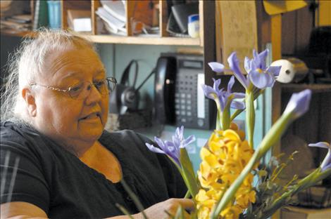 St-Char-Ro Janet Gardner works on a bouquet, 40 years after the family’s floral and event shop opened