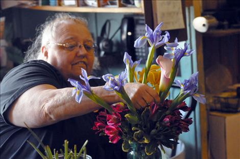 St-Char-Ro Janet Gardner works on a bouquet, 40 years after the family’s floral and event shop opened