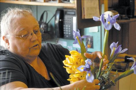 St-Char-Ro Janet Gardner works on a bouquet, 40 years after the family’s floral and event shop opened