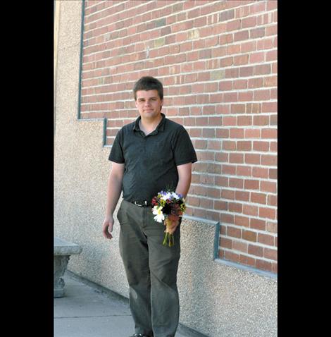 John Romero works in St-Char-Ro, the flower shop he partially owns with his family. 