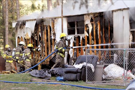 Firefighters continue to fight the blaze right down to the studs.