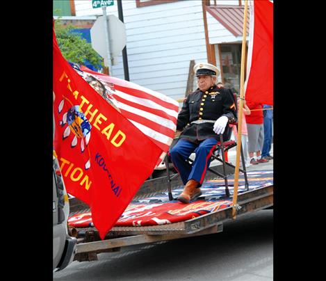 WW II veteran and Salish elder Frances Stanger rode behind a drum group.