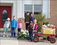 Preschoolers donate toys to Helping Hands