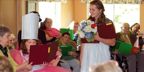 Glinda the good witch reads her lines as Dorothy and Auntie Em look on during the production of “The Wizard of Oz” put on by Polson Health and Rehabilitation 