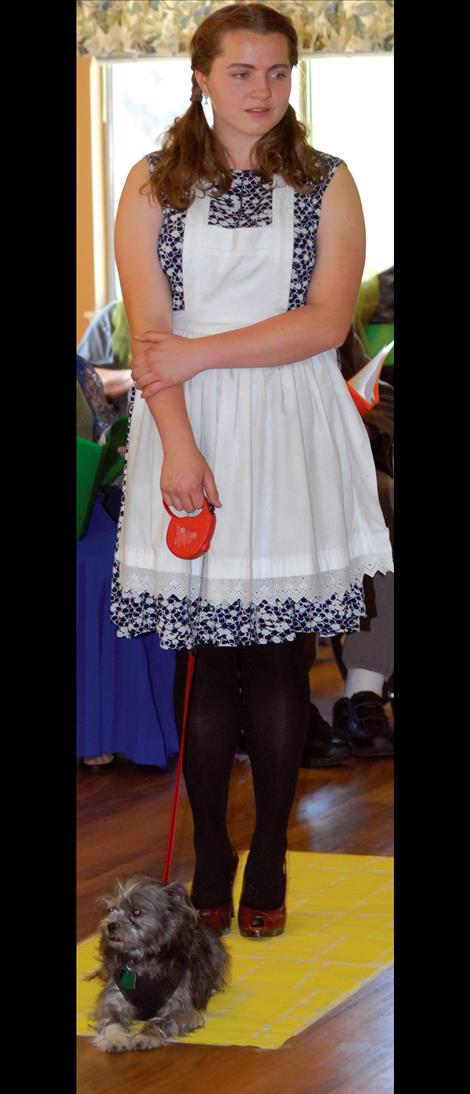 Dorothy and Toto stand on the yellow brick road during Polson Health and Rehabilitation Center’s play.