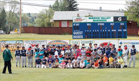 Below: Campers and Mariners players gather for a photo after wrapping up camp Saturday morning. Forty-seven young ball players attended the camp this year.