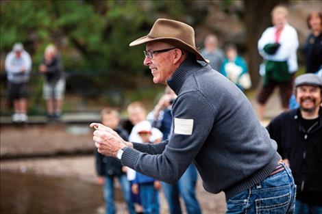 Darryl Sutton, Sherwood Park, Alberta, focuses on his throw at the Saturday morning Flathead Lake Rock Skipping contest.