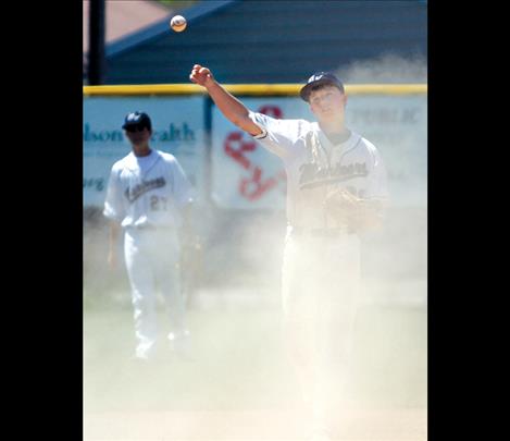 Jacob Harrod fields a dusty ball during round one Sunday afternoon.