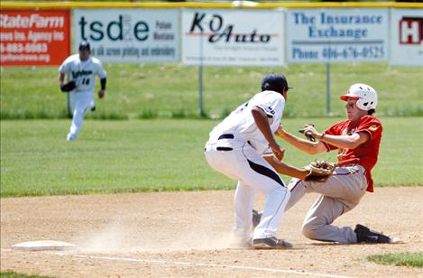 Mariners third baseman Jonah Burke tags out a Kalispell Lakers runner during the first round of Sunday’s doubleheader.